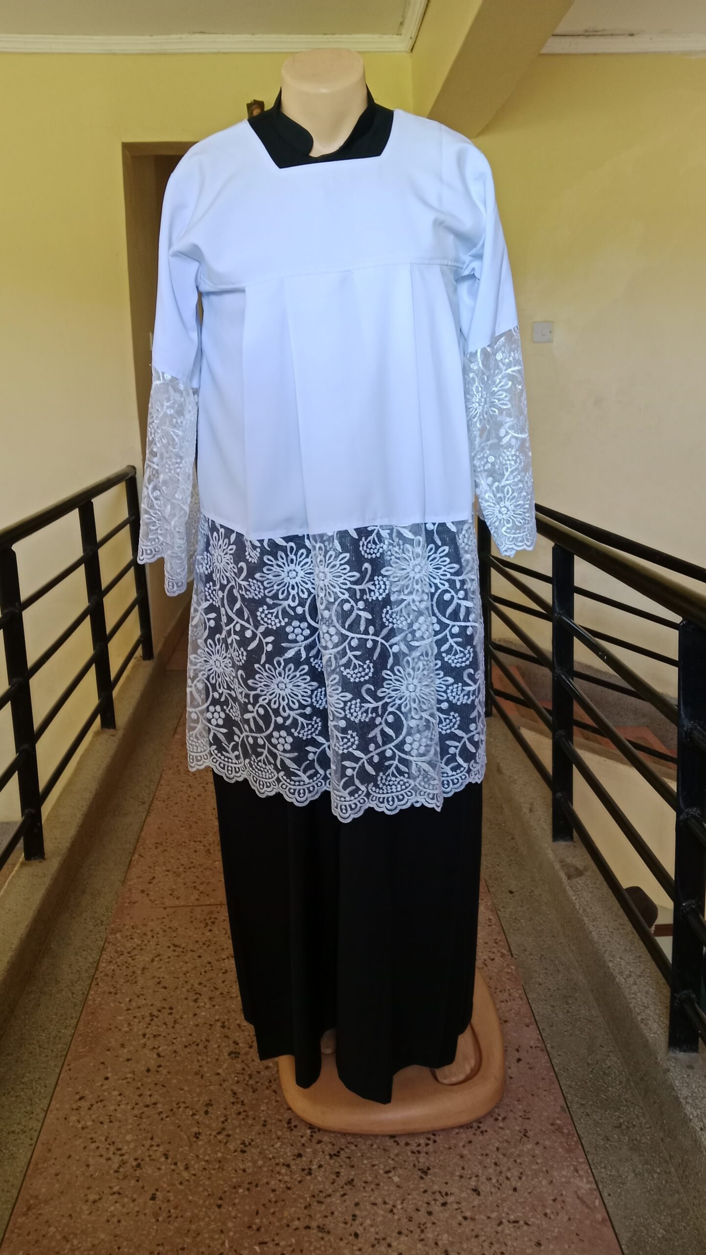 Black Cassock with White Floral Lace Surplice
